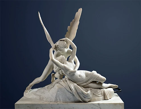 eros-y-psique-escultura-canova.jpg La historia de Eros y Psique procede de la antigüedad griega; sin embargo la conocemos por Las metamorfosis o El asno de oro de Apuleyo, en la que una anciana narra la historia “para mitigar los temores de una jovencita a quien el destino había preparado funestos sucesos”. Psique reanimada por el beso del amor de Antonio Canova, grupo escultórico de bulto redondo en mármol de Carrara, Museo del Louvre, París.